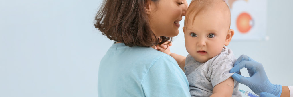 a woman holding a baby